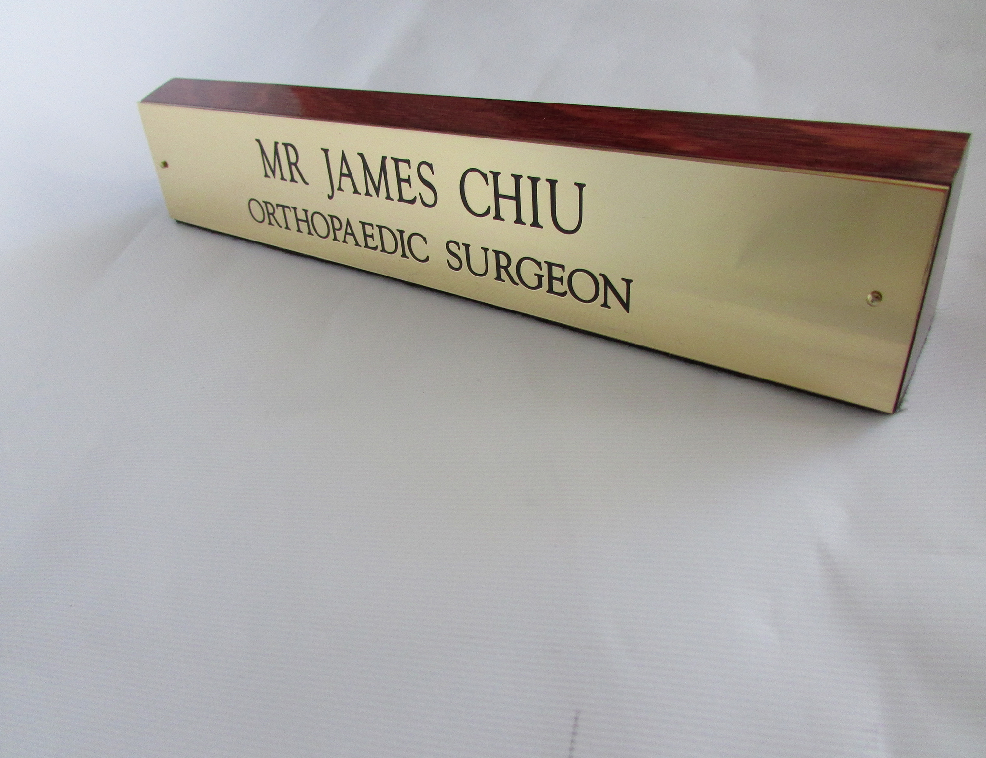 Brass and wood nameplate engraved