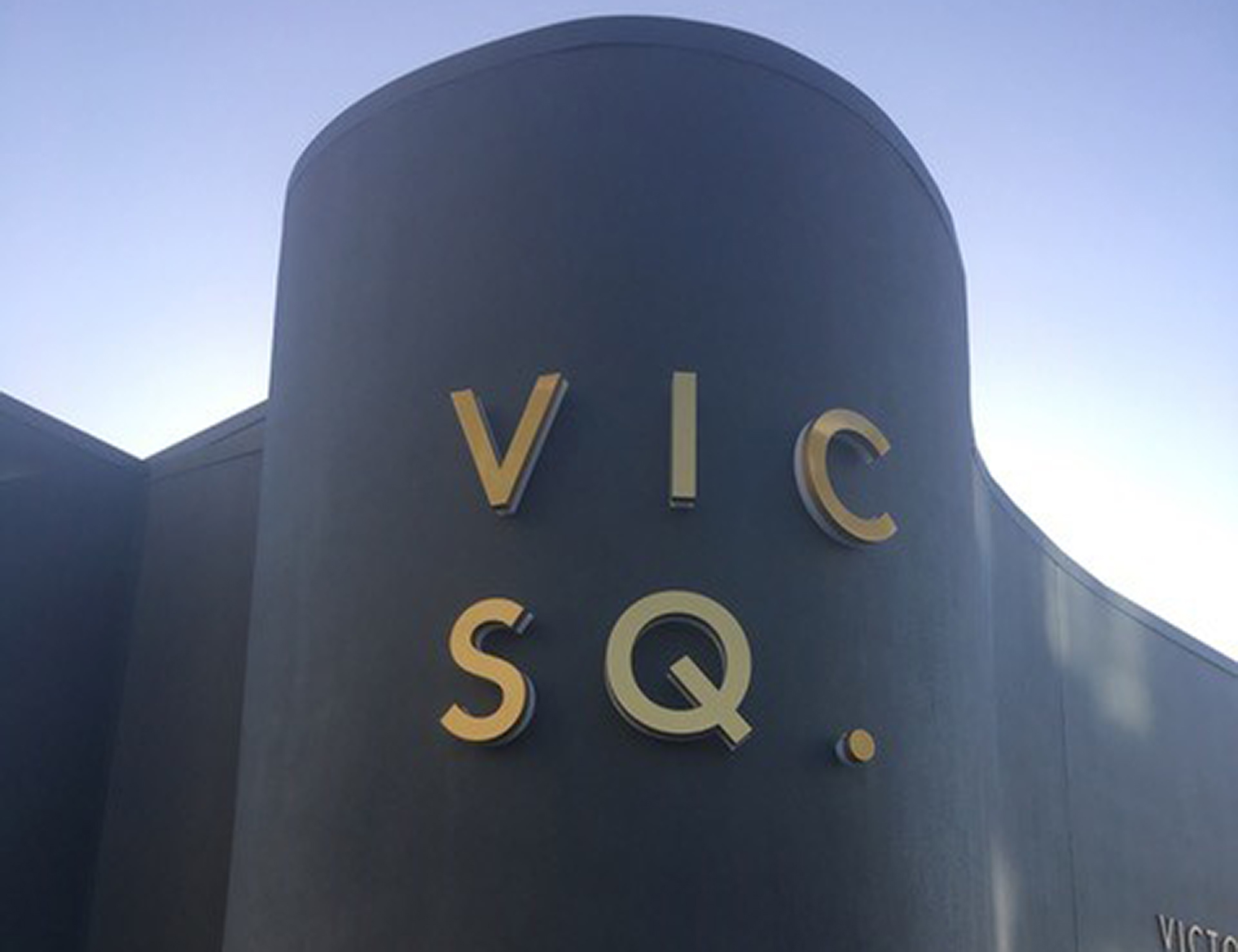 vic-square-apartments-backlit-sign